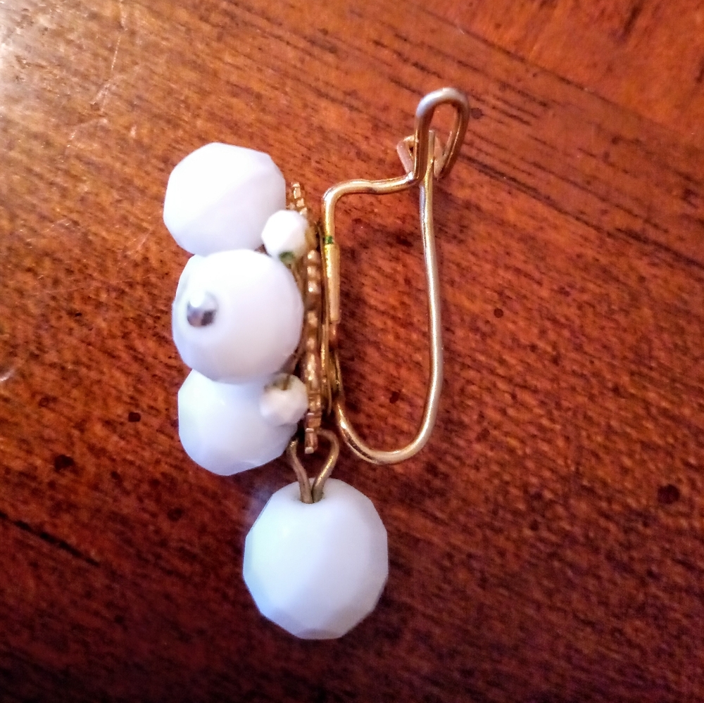 Vintage Judith McCann wingback earrings White